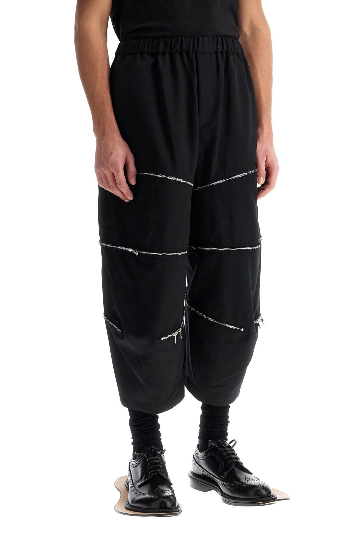 Comme Des Garcons Black Cropped Pants With Zip Openings.